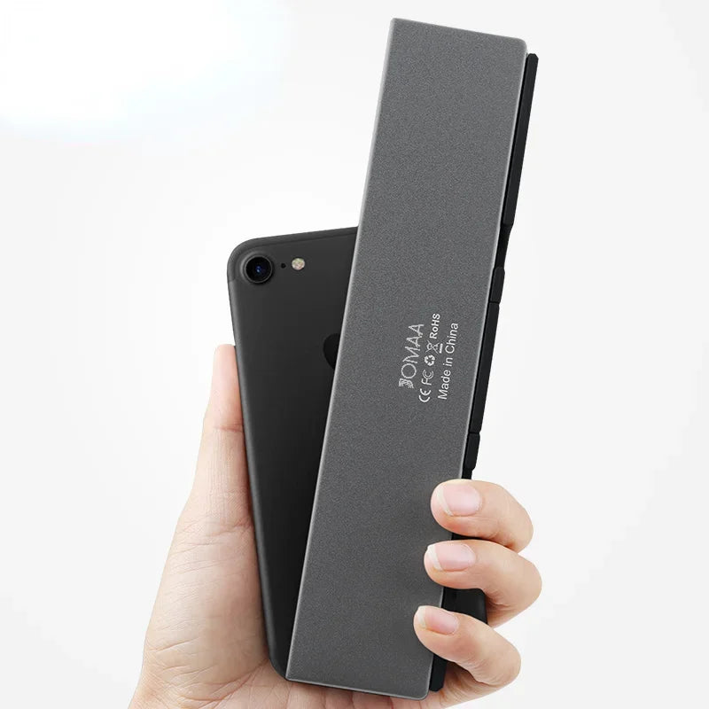 Our New 2025 collection  Foldable Bluetooth Keyboard Rechargeable Keyboard Mini Folding Wireless Keyboard Aluminum Keypad With Stand For Phone